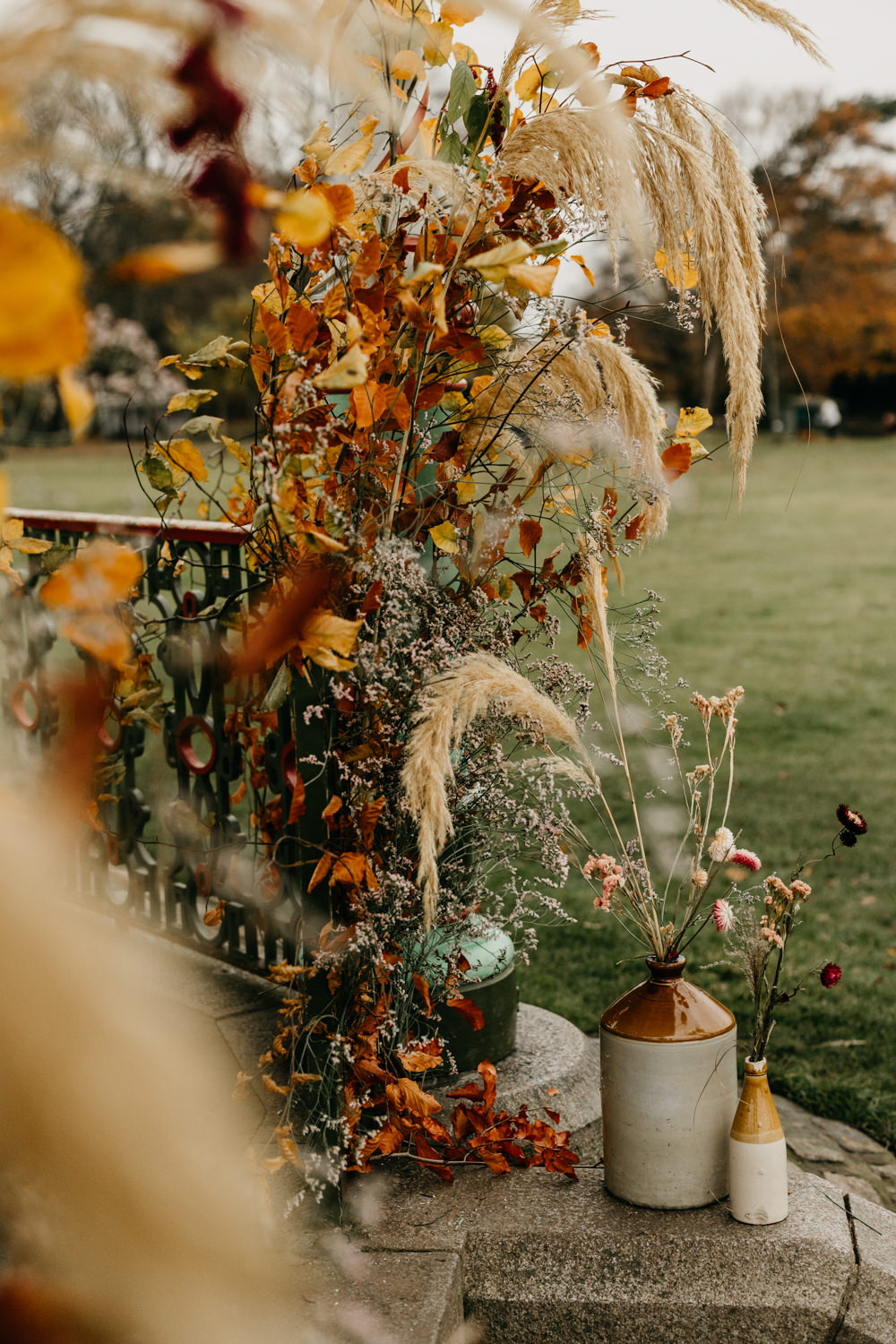 Orange Red Dahlia Outdoor Ceremony Autumn Flowers Pampas Grass Bandstand Wedding Emma Lawson Photography