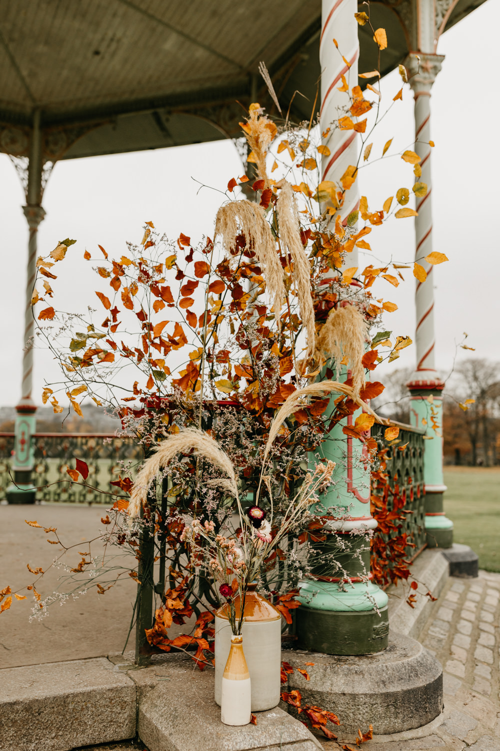 Orange Red Dahlia Outdoor Ceremony Autumn Flowers Pampas Grass Bandstand Wedding Emma Lawson Photography