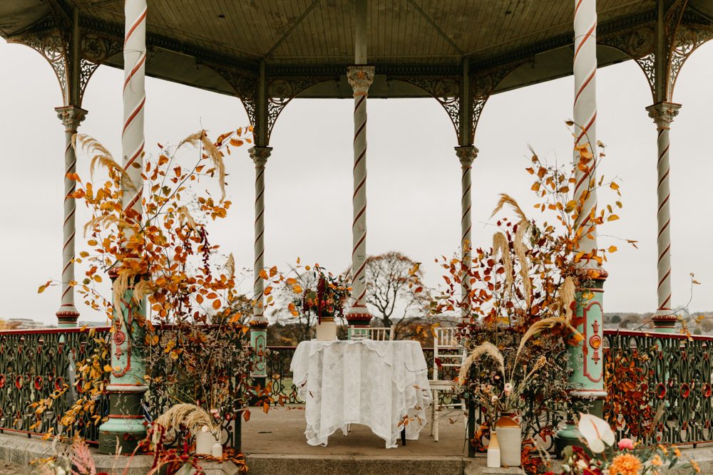 Orange Red Dahlia Outdoor Ceremony Autumn Flowers Bandstand Wedding Emma Lawson Photography