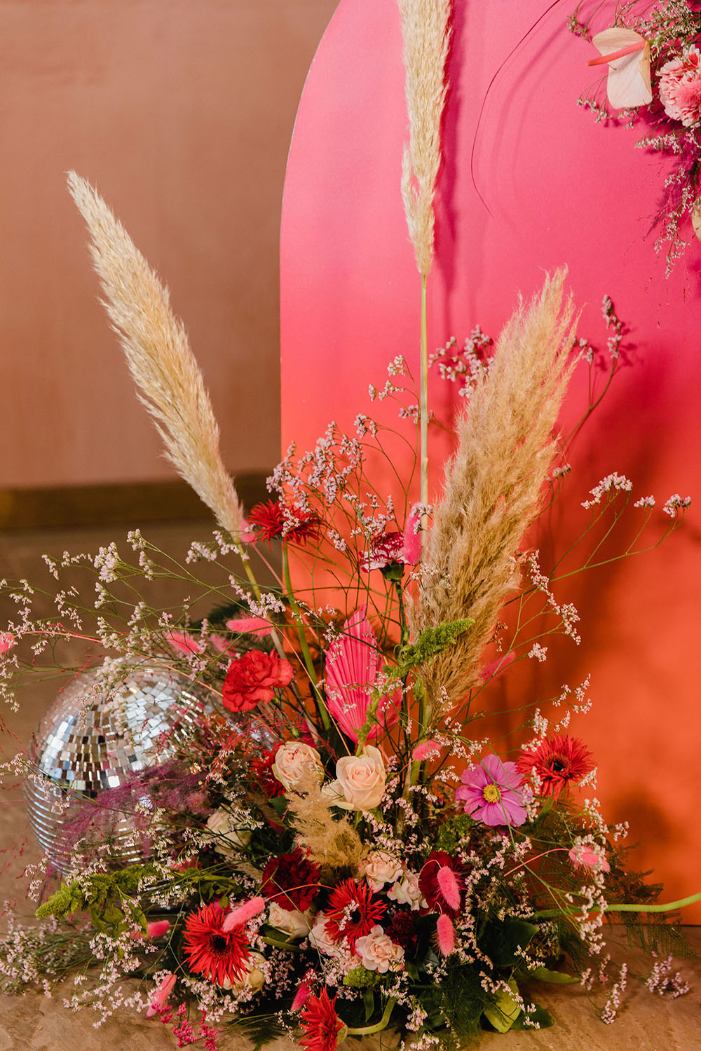 Curved Backdrop Pink Orange Flowers Pampas Grass Disco Ball Wedding Michelle Huggleston