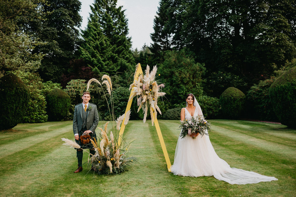 Outdoor Ceremony Triangle A Frame Pampas Grass Elsick House Wedding Firefly and Embers Photography