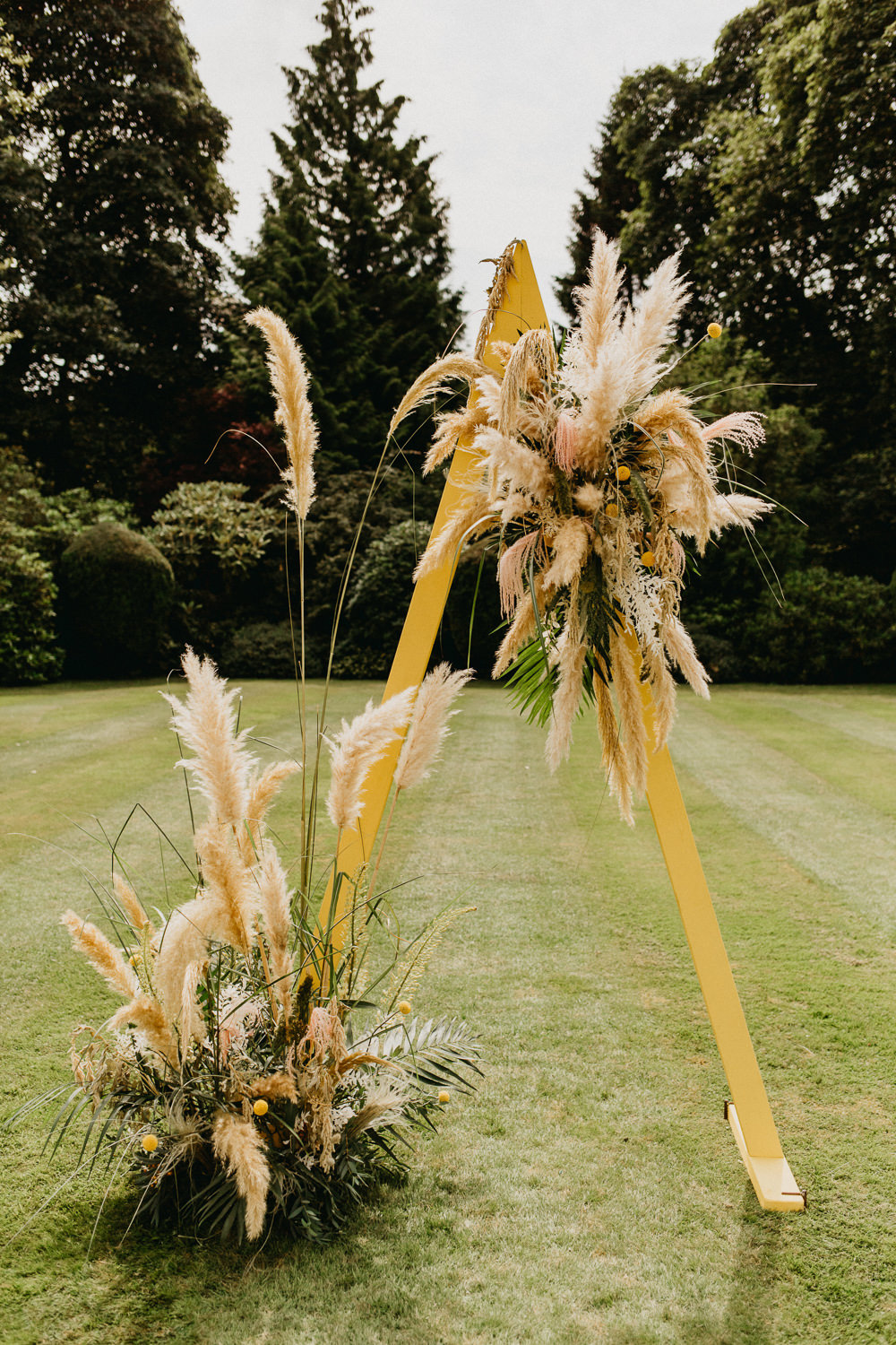 Outdoor Ceremony Triangle A Frame Pampas Grass Elsick House Wedding Firefly and Embers Photography