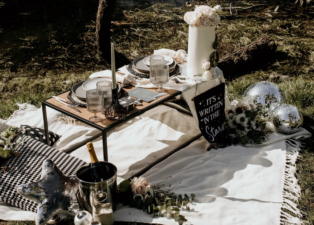 Picnic Table Tablescape Blankets Flowers Candles Interstellar Wedding Ideas Doriane Descamps Photography
