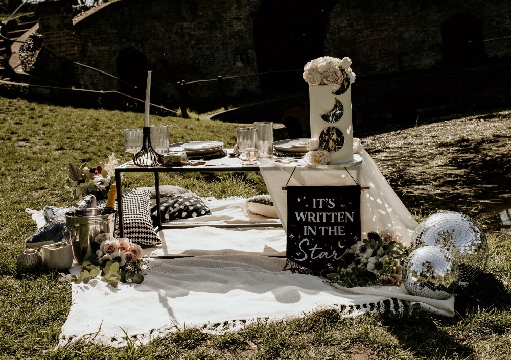 Picnic Table Tablescape Blankets Flowers Candles Interstellar Wedding Ideas Doriane Descamps Photography
