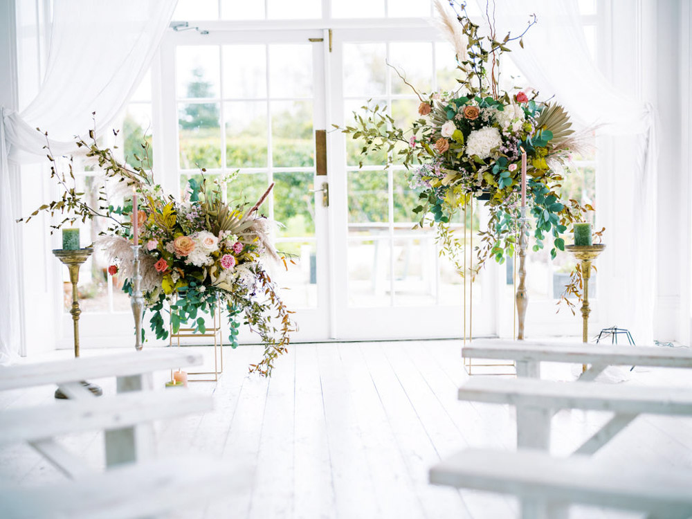 Blue Wedding Dress Into The Light Flower Installation Aisle Ceremony Tall Candles