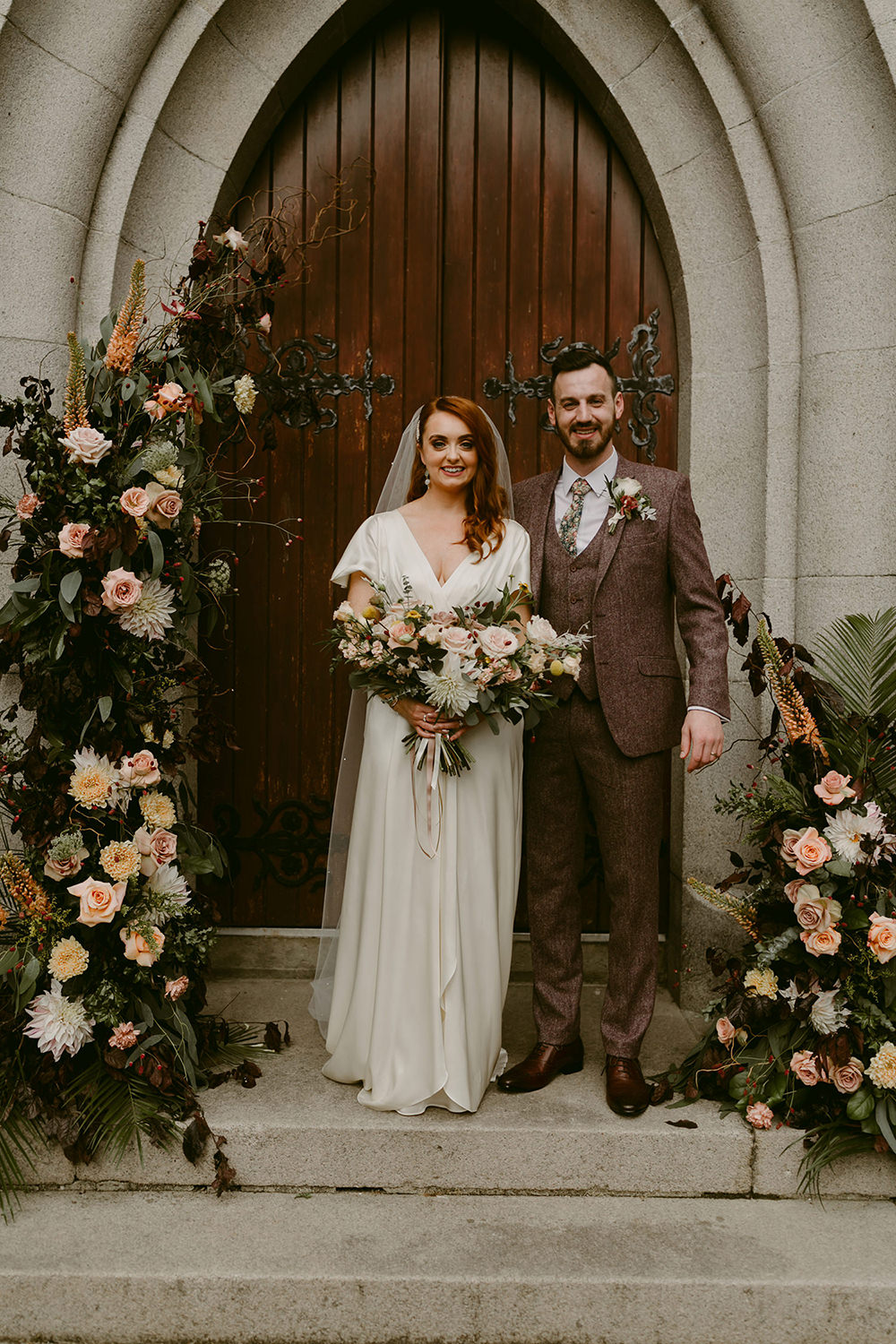 Darver Castle Wedding Adam and Grace Flower Arch Installation Church Door Entrance Pink Rose Greenery
