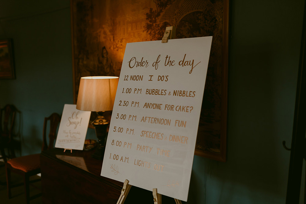 Order of the Day Sign Rose Gold Lissanoure Castle Wedding Adam and Grace