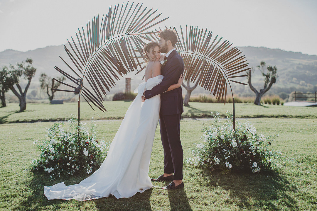 Whimsical Tuscany Wedding Sofia Balli Palm Backdrop Ceremony Aisle Flowers