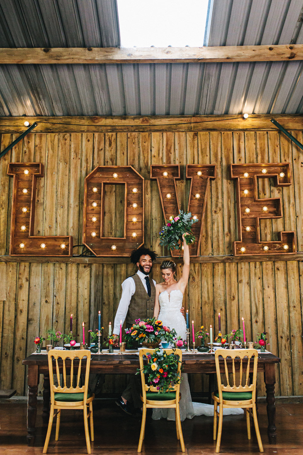 Cheshire Woodland Weddings Jessica O’Shaughessy Wedding Photography Barn Decor Table Tablescape Flowers Candles Colourful Bright