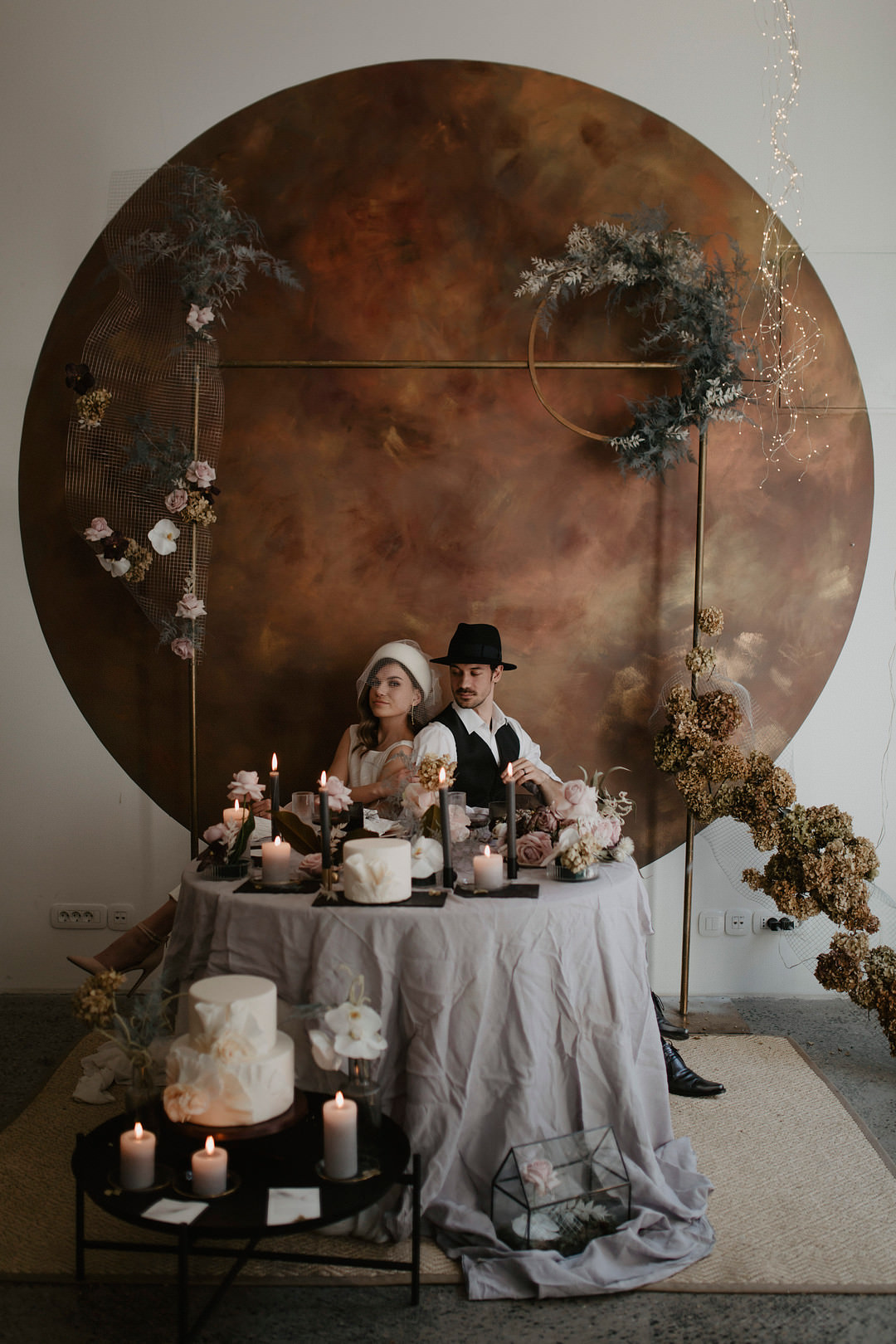 Croatia Wedding Inspiration JoTable Decor Grey Candles Pink Flowers Tablescape Flower Arch Backdrop