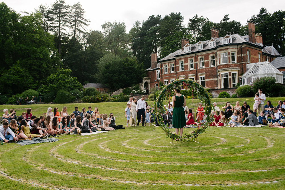 Nanpantan Hall Wedding Aden Priest Photography Circle Ceremony Moongate Flower Arch