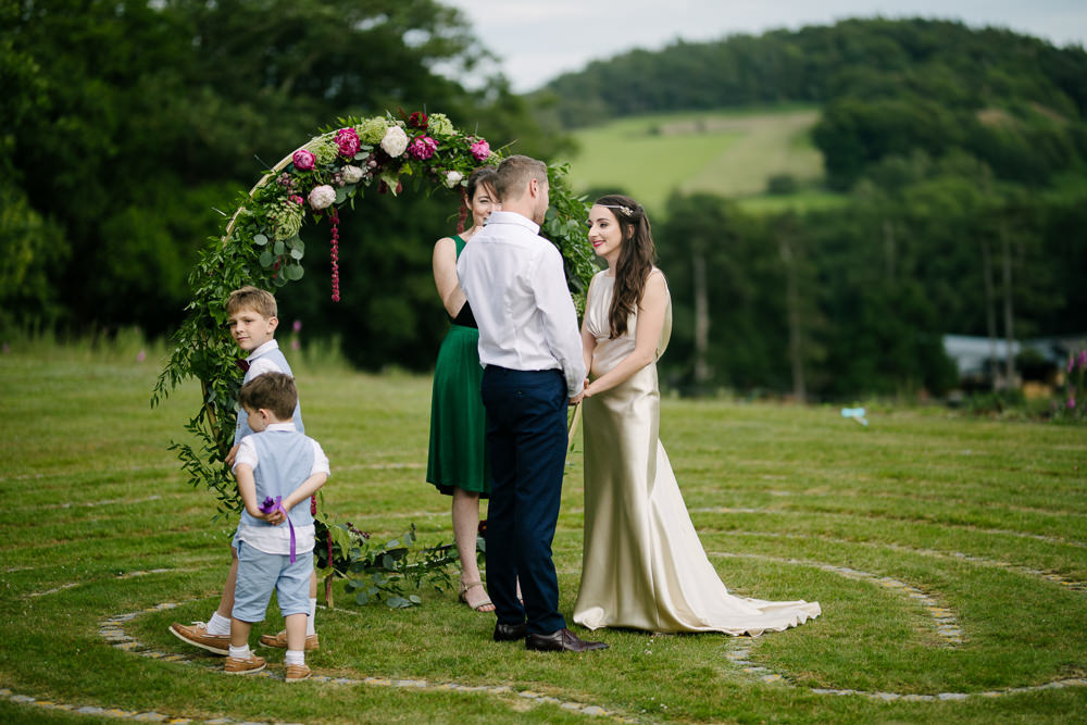 Nanpantan Hall Wedding Aden Priest Photography Circle Ceremony Moongate Flower Arch