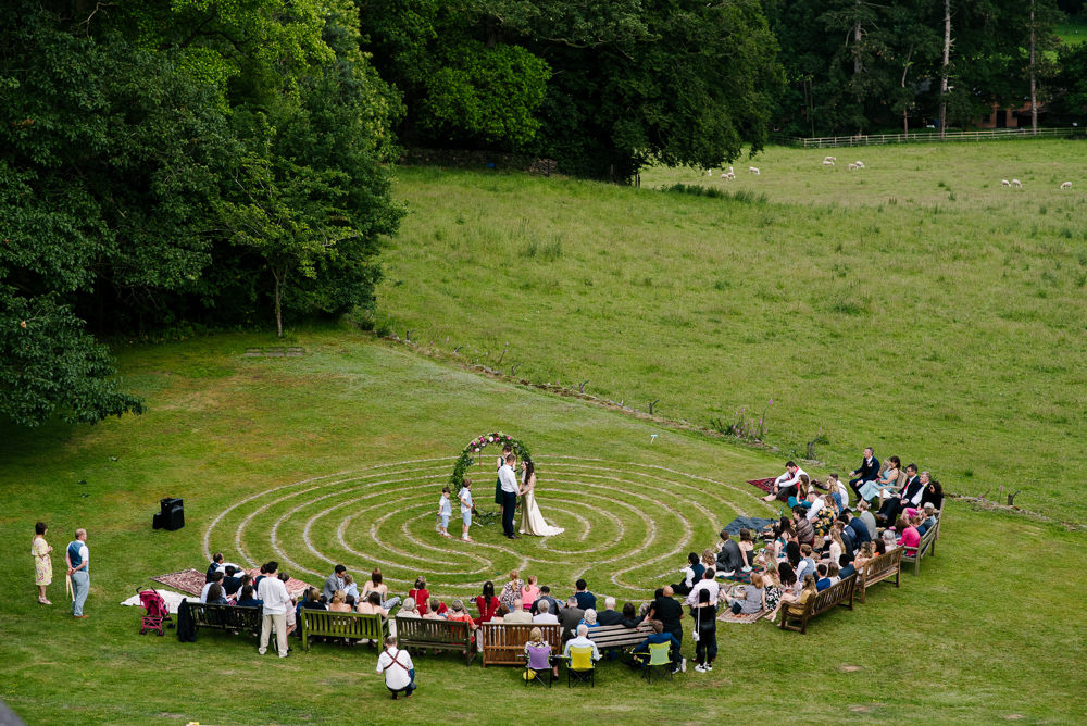 Nanpantan Hall Wedding Aden Priest Photography Circle Ceremony Moongate Flower Arch
