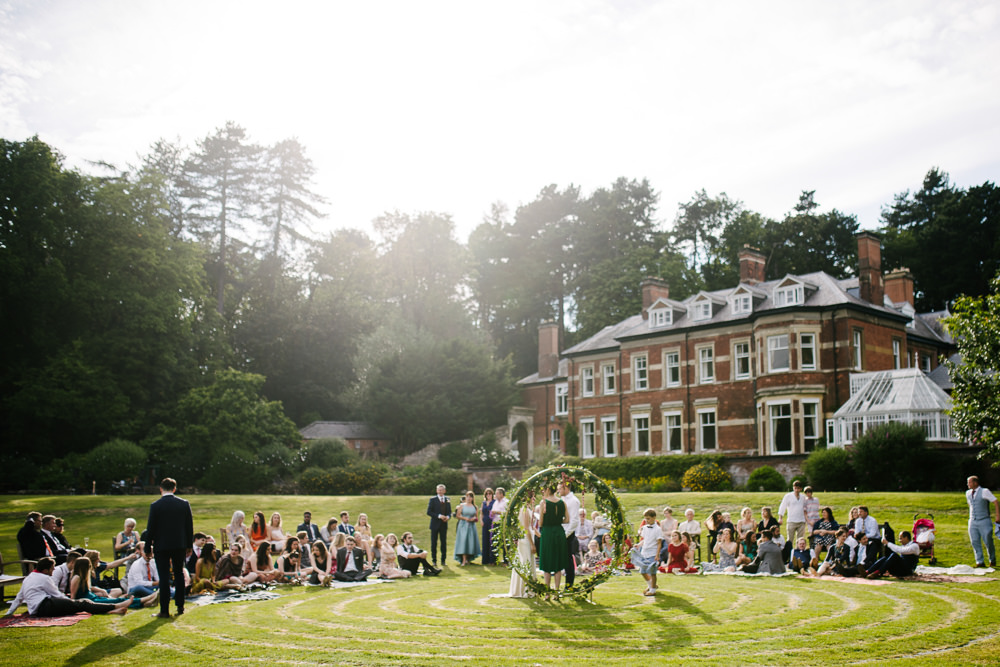 Nanpantan Hall Wedding Aden Priest Photography Circle Ceremony Moongate Flower Arch