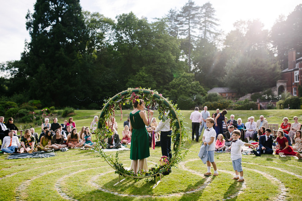 Nanpantan Hall Wedding Aden Priest Photography Circle Ceremony Moongate Flower Arch