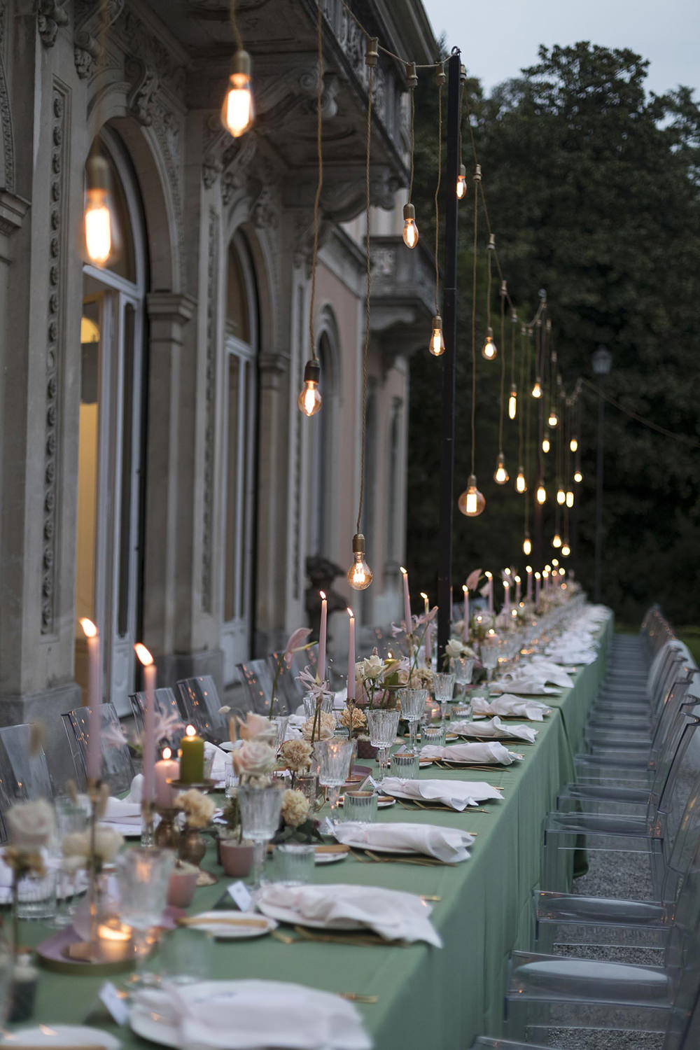 Table Decor Flowers Ghost Chairs Modern Festoon Lights Green Pink Villa del Grumello Wedding L’Ordine della Giarrettiera
