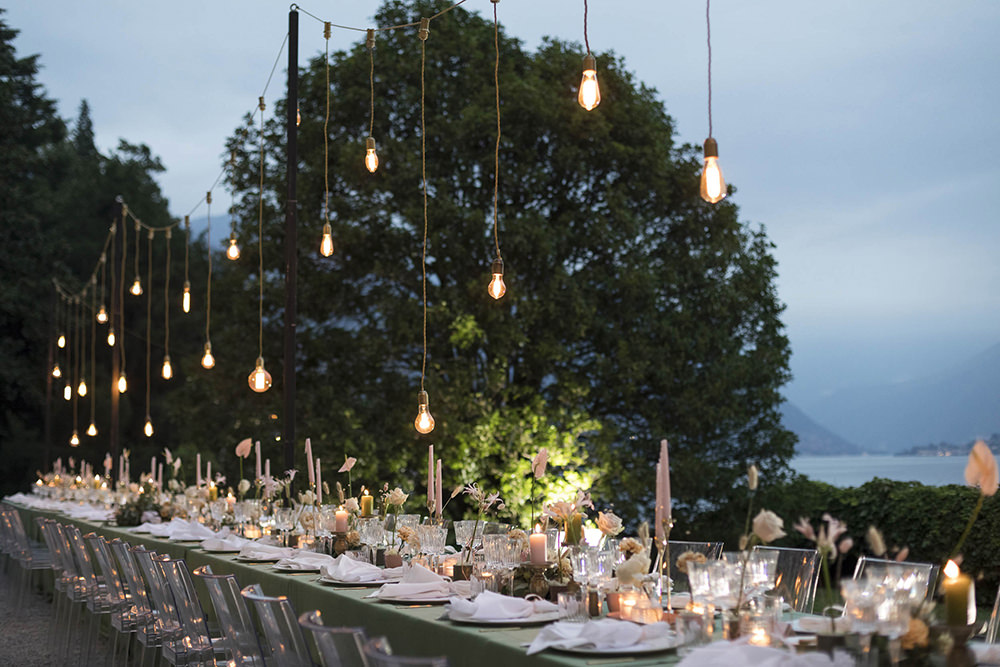 Table Decor Flowers Ghost Chairs Modern Festoon Lights Green Pink Villa del Grumello Wedding L’Ordine della Giarrettiera