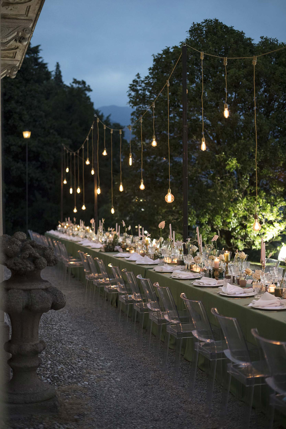 Table Decor Flowers Ghost Chairs Modern Festoon Lights Green Pink Villa del Grumello Wedding L’Ordine della Giarrettiera