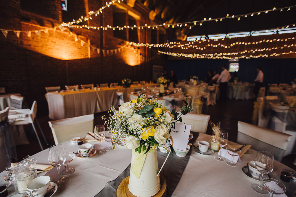 Jug Flowers Yellow Centrepiece Wet Wedding JSCoates Wedding Photographer