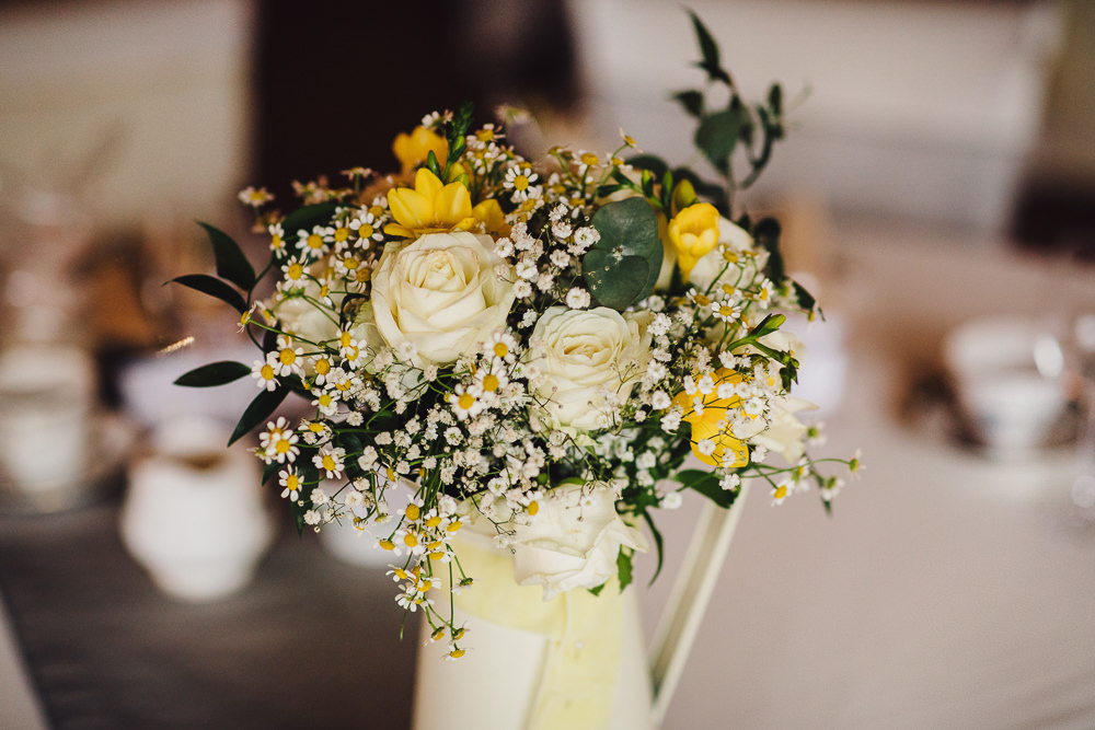 Jug Flowers Yellow Centrepiece Wet Wedding JSCoates Wedding Photographer