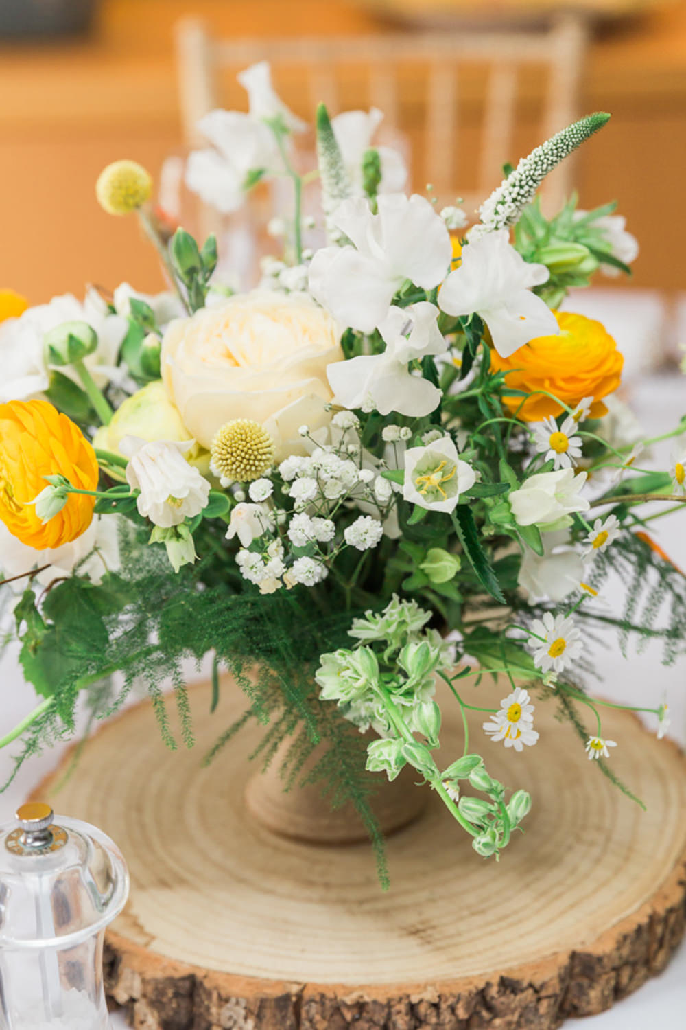 Centrepiece Flowers Jug Yellow White Log Slice Combe House Hotel Wedding James and Kerrie Photography
