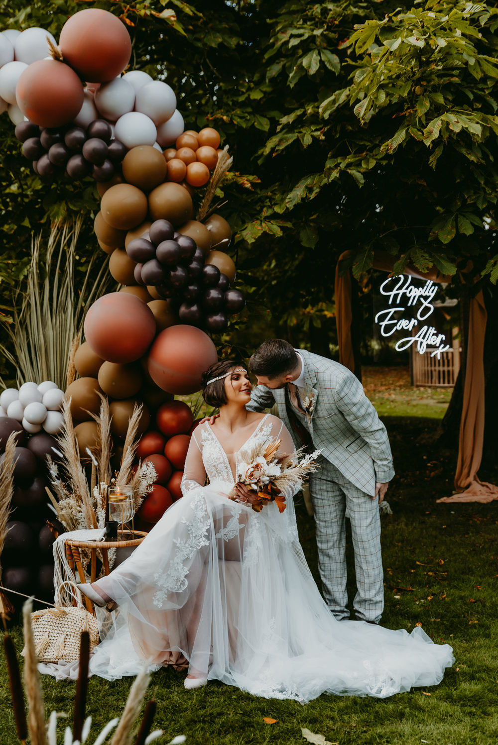 Small Tent Wedding Emberwood Photography Balloon Installation Decor Brown Bronze Grass Flowers Decor