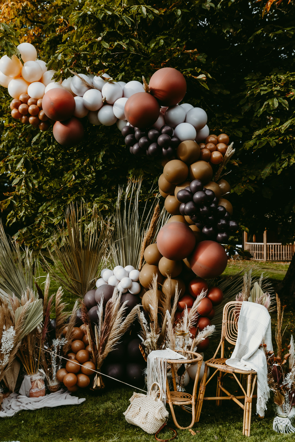 Balloon Installation Decor Brown Bronze Grass Flowers Decor Small Tent Wedding Emberwood Photography