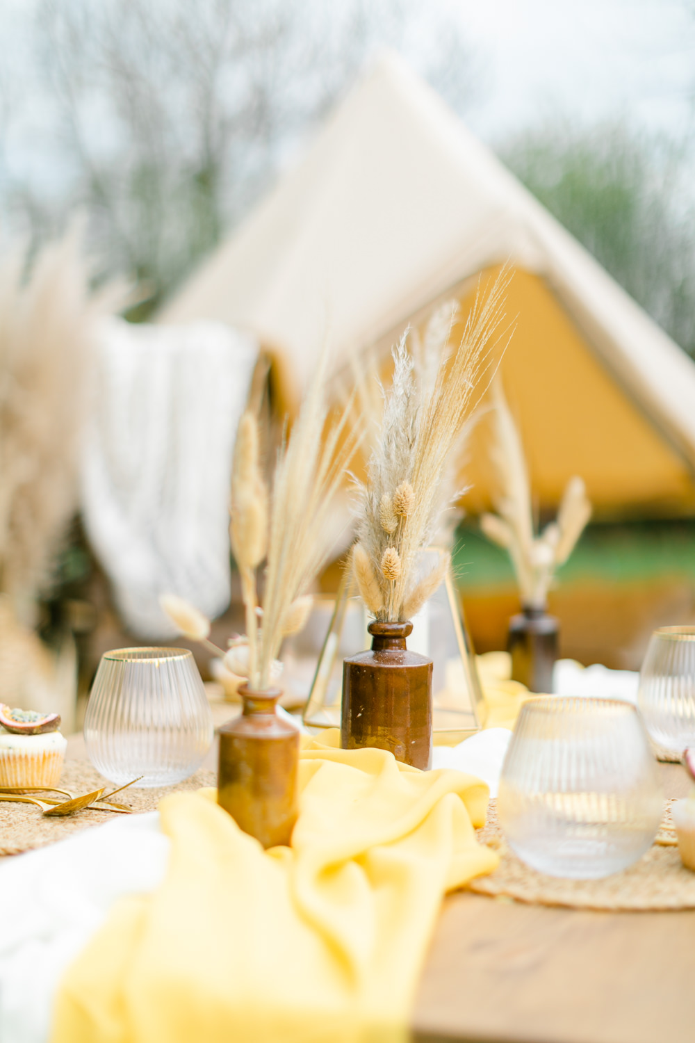 Table Decor Brown Glass Bottles Pampas Grass Yellow Cloths Boho Spring Wedding Jessica Holt Photography