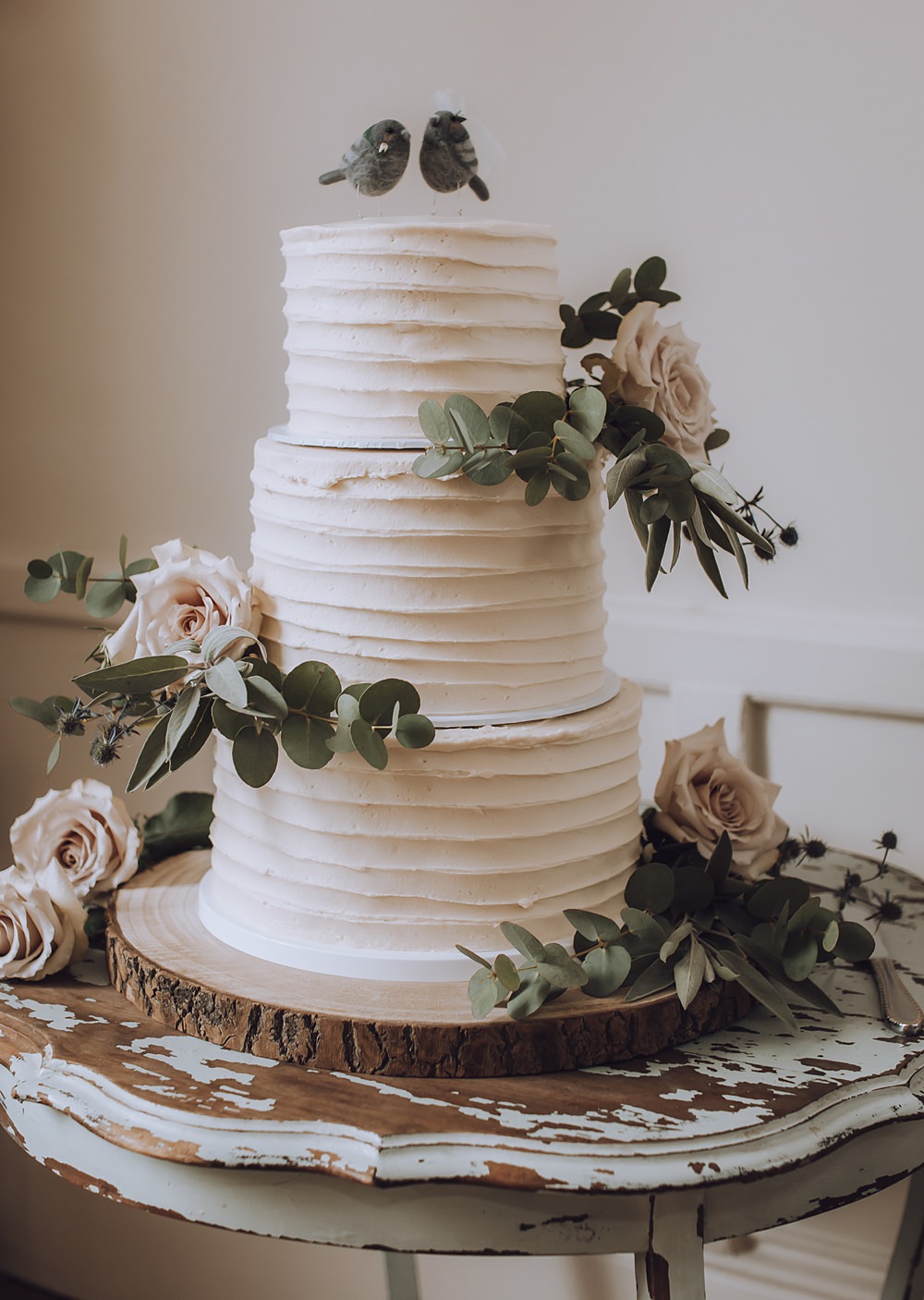 Three Tier Buttercream Cake White Flowers Greenery Log Slice Blue Pigeons Wedding Charlotte Claricoat Photography