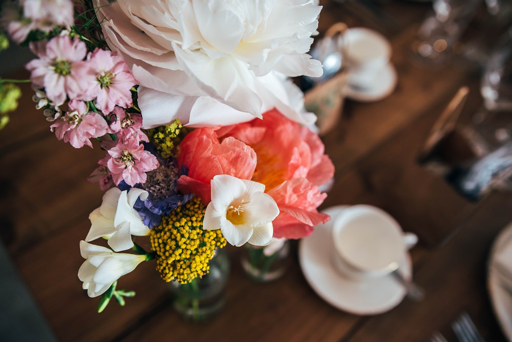 Glass Bottle Centrepiece Flowers Coral Charm Peony Essex Barn Wedding Three Flowers Photography