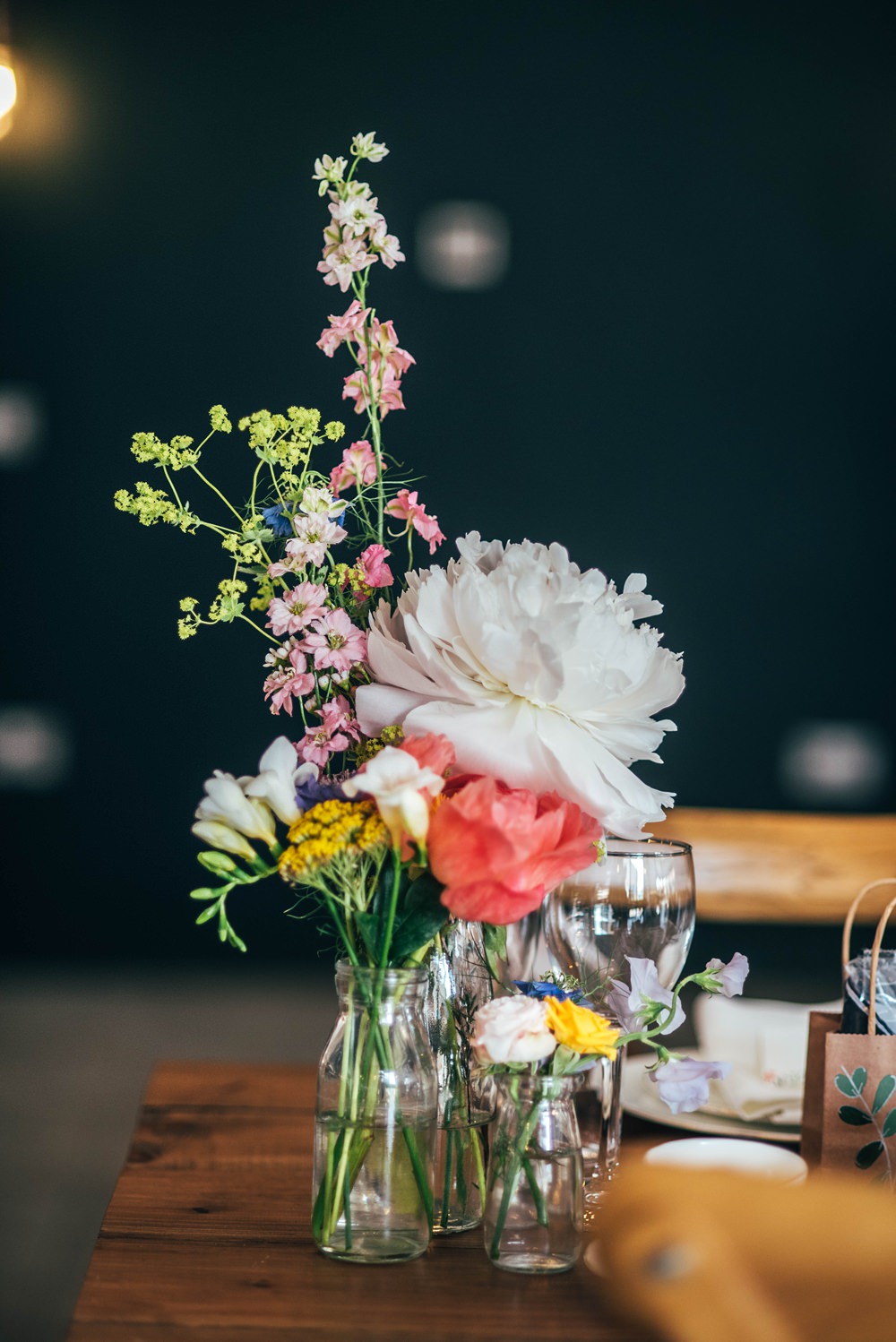 Glass Bottle Centrepiece Flowers Coral Charm Peony Essex Barn Wedding Three Flowers Photography