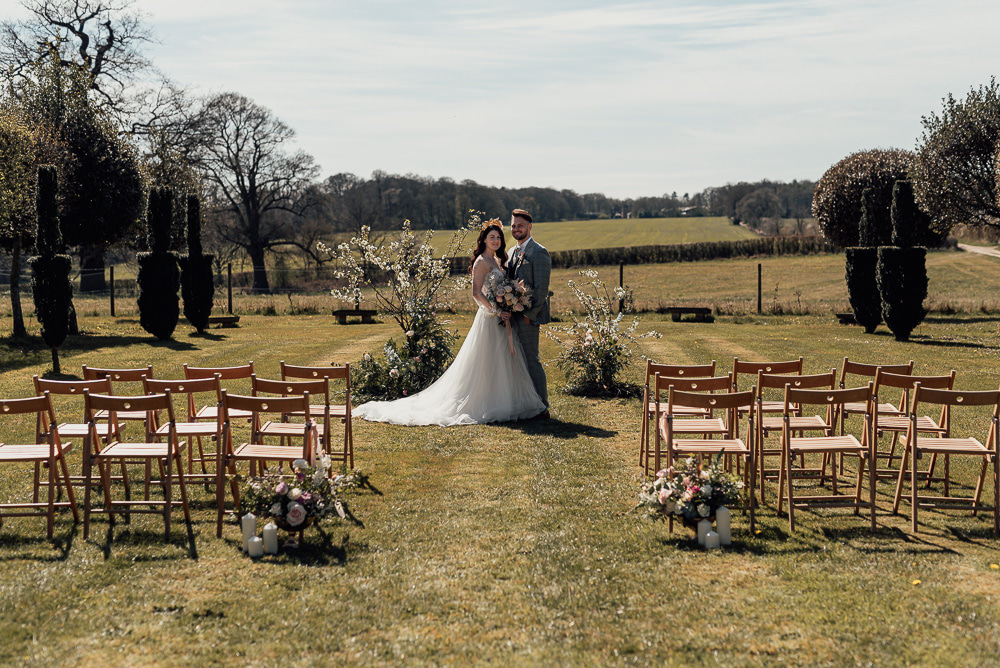 Outdoor Ceremony Field Flowers Installation Gaddesden Estate Wedding Clare Smith Photography