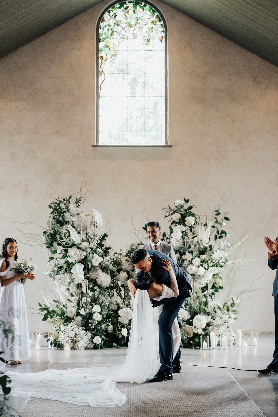 Stones of the Yarra Valley Wedding Rick Liston Photography Ceremony Flower Installation Backdrop White Greenery