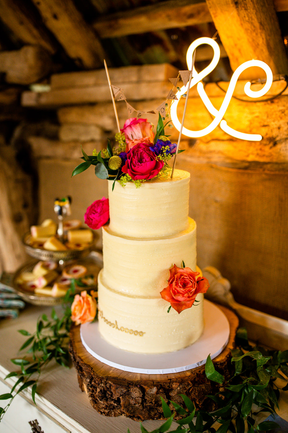 Three Tier Cream Cake Pink Flowers Bunting Topper Travel Theme Wedding Livvy Hukins Photography