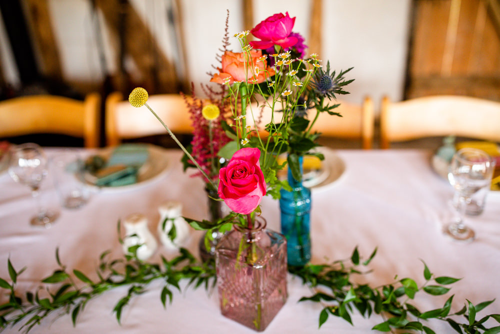 Table Flowers Glass Bottles Travel Theme Wedding Livvy Hukins Photography