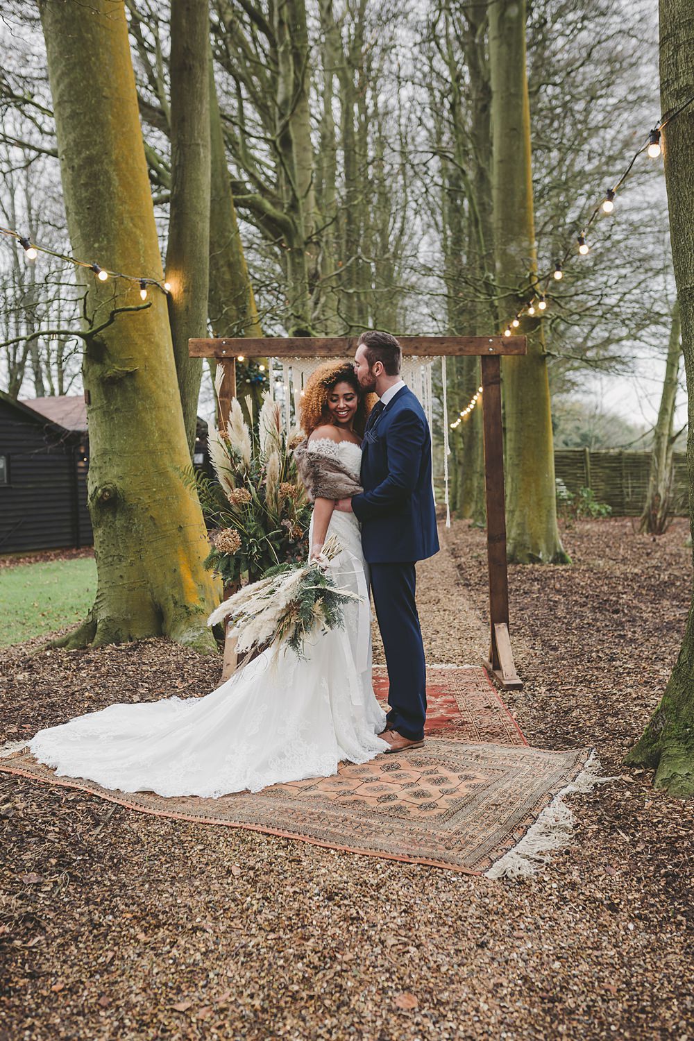 Woodland Ceremony Rug Aisle Wooden Frame Macrame Backdrop Festoon Lights Christmas Wedding Ideas Mini and Me Photography