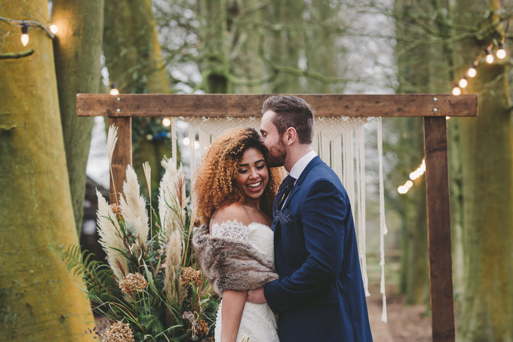 Woodland Ceremony Rug Aisle Wooden Frame Macrame Backdrop Festoon Lights Christmas Wedding Ideas Mini and Me Photography