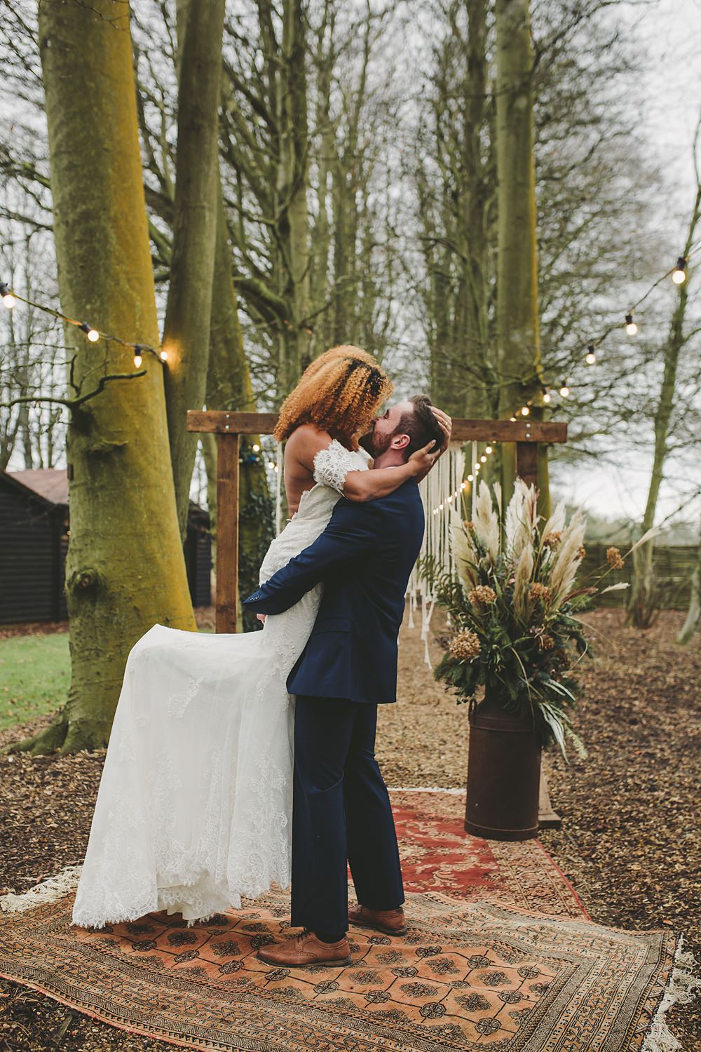 Woodland Ceremony Rug Aisle Wooden Frame Macrame Backdrop Festoon Lights Christmas Wedding Ideas Mini and Me Photography