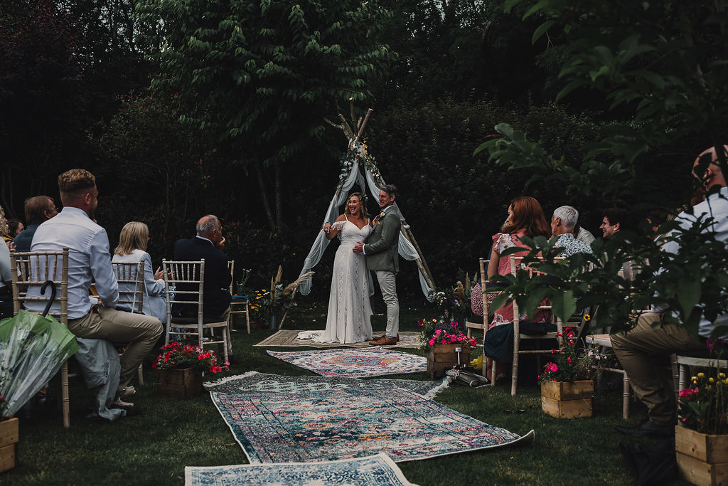 DIY Boho Wedding Jade Maguire Photography Naked Tipi Ceremony Backdrop Flowers Fabric Rugs Aisle