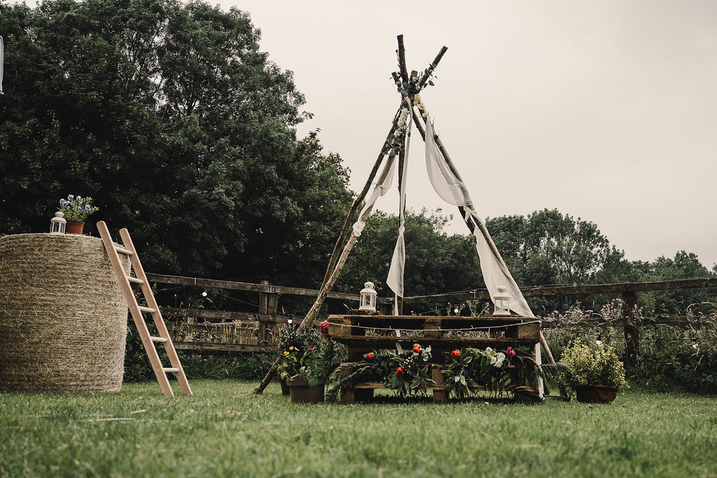 Naked Tipi Ceremony Backdrop Flowers Fabric DIY Boho Wedding Jade Maguire Photography