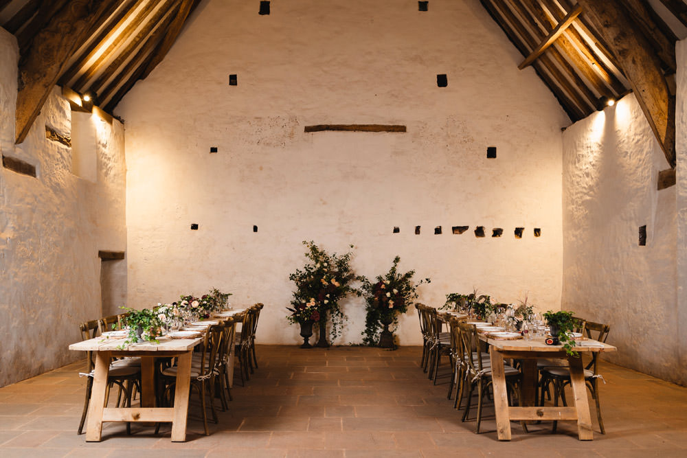 Long Wooden Tables Greenery Flowers Runner Rustic Rattan Place Mats Medieval Barn Wedding Sam Gibson Photography