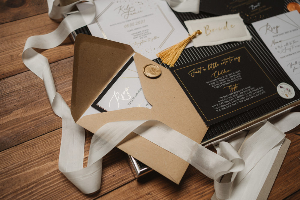 Stationery Invite Invitation Black Gold Wax Seal Tassel Upthorpe Wood Wedding Emily Tyler Photography