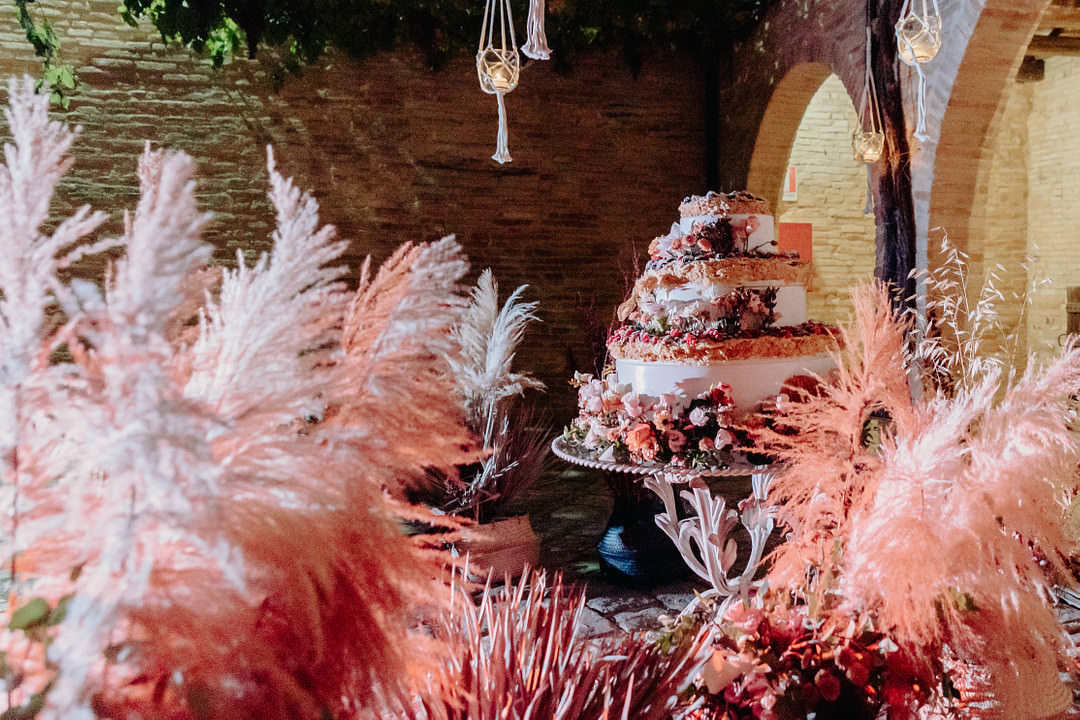 Large Three Tier Cake Flowers Vineyard Wedding Italy Claudia Santi Photography