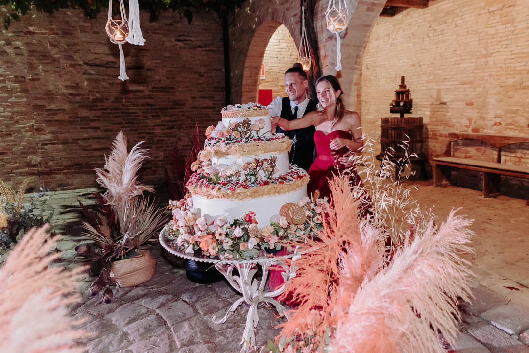 Large Three Tier Cake Flowers Vineyard Wedding Italy Claudia Santi Photography