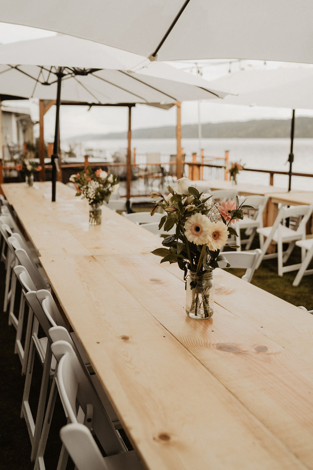 Long Wooden Table Centrepiece Flowers Washington Lakeside Wedding Claudia Noelle Photography