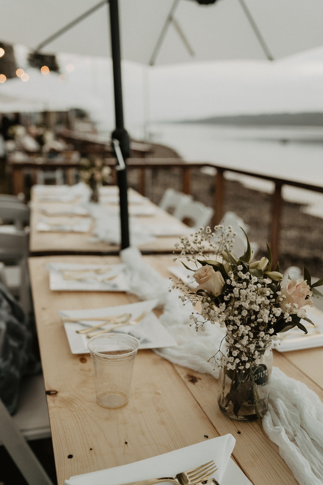 Long Wooden Table Centrepiece Flowers Washington Lakeside Wedding Claudia Noelle Photography