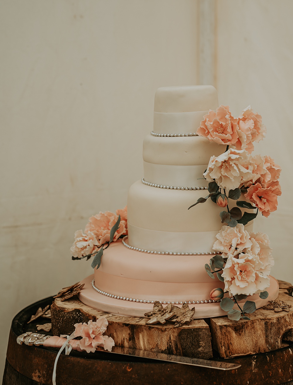Four Tier Iced Cake Roses Wooden Barrel Table Whimsical Wonderland Wedding Amber Louise Photography