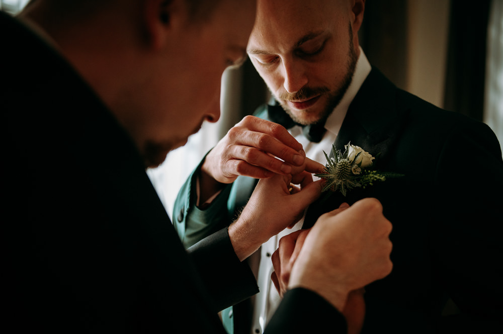 Groom Green Suit Black Bow Tie Buttonhole Flowers Bethnal Green Wedding Andrew Brannan Photography