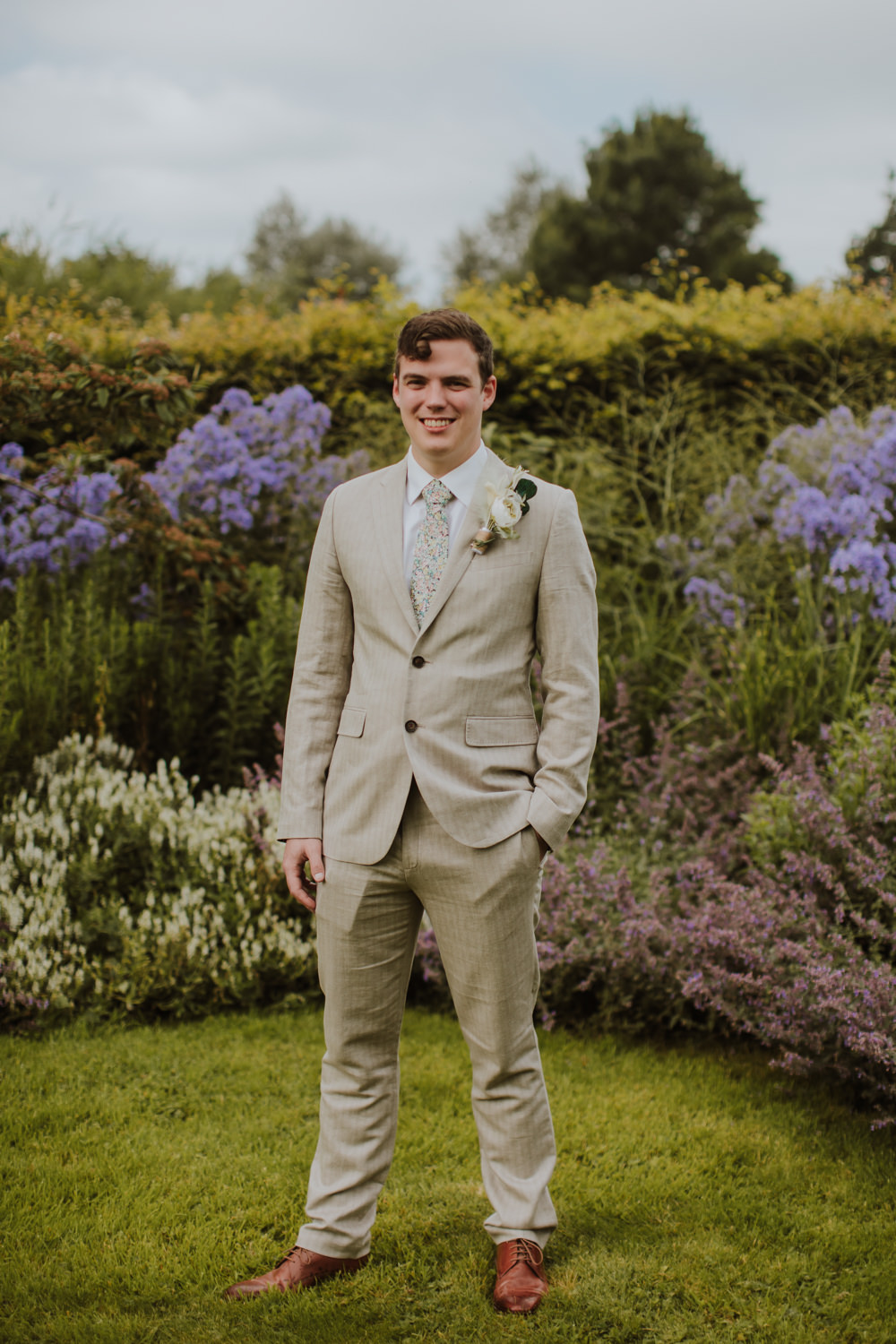 Groom Cream Linen Suit Green Tie Buttonhole Flowers Festival Farm Wedding Sam Bennett Photography