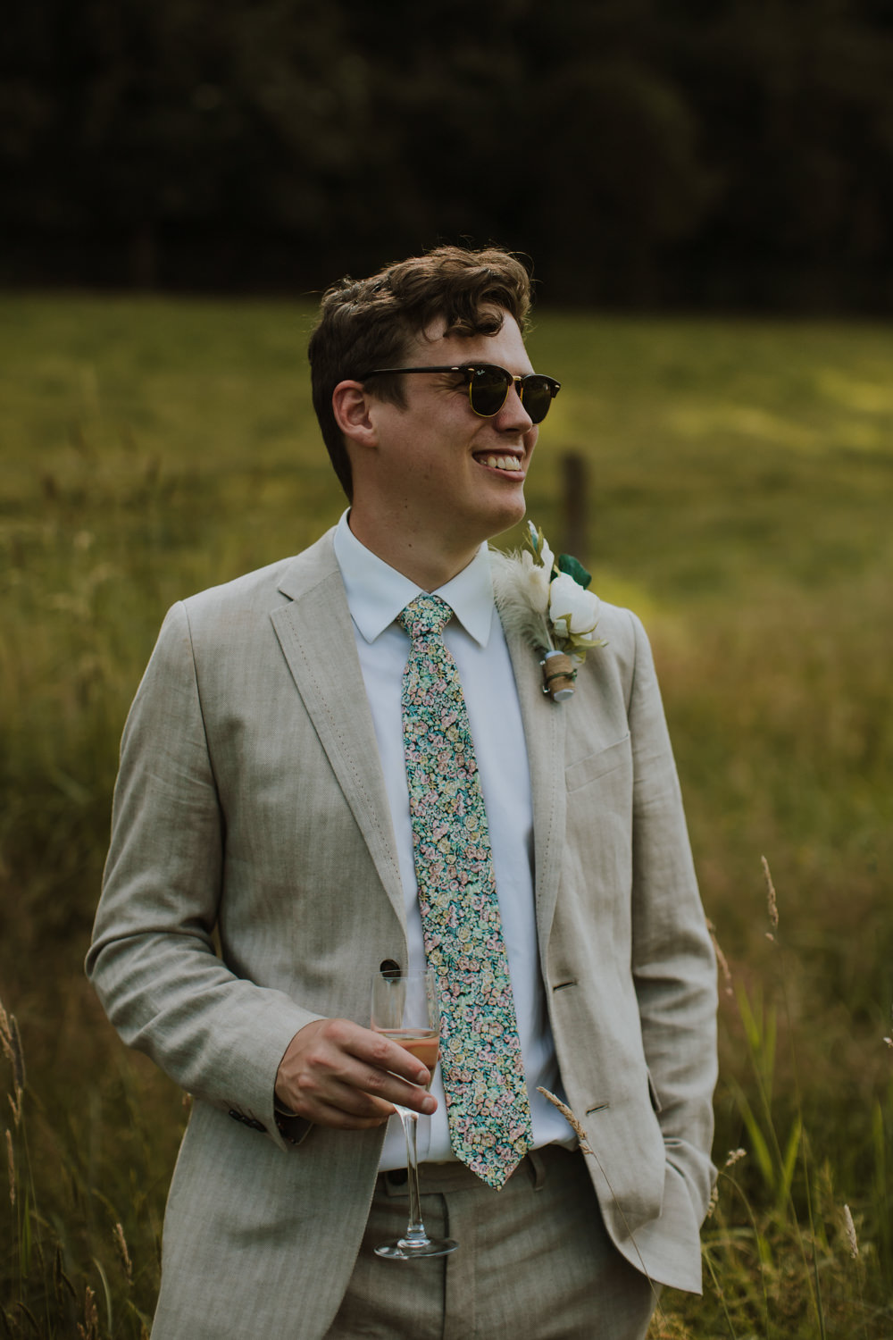 Groom Cream Linen Suit Green Tie Buttonhole Flowers Festival Farm Wedding Sam Bennett Photography